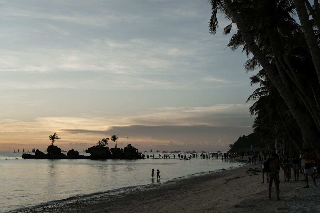 Visitors at the main beach of Boracay, Aklan, the Philippines. Almost 100,000 tourists arrived in the five weeks through March as the Philippines reopened to 157 visa-free countries. Photo: Bloomberg