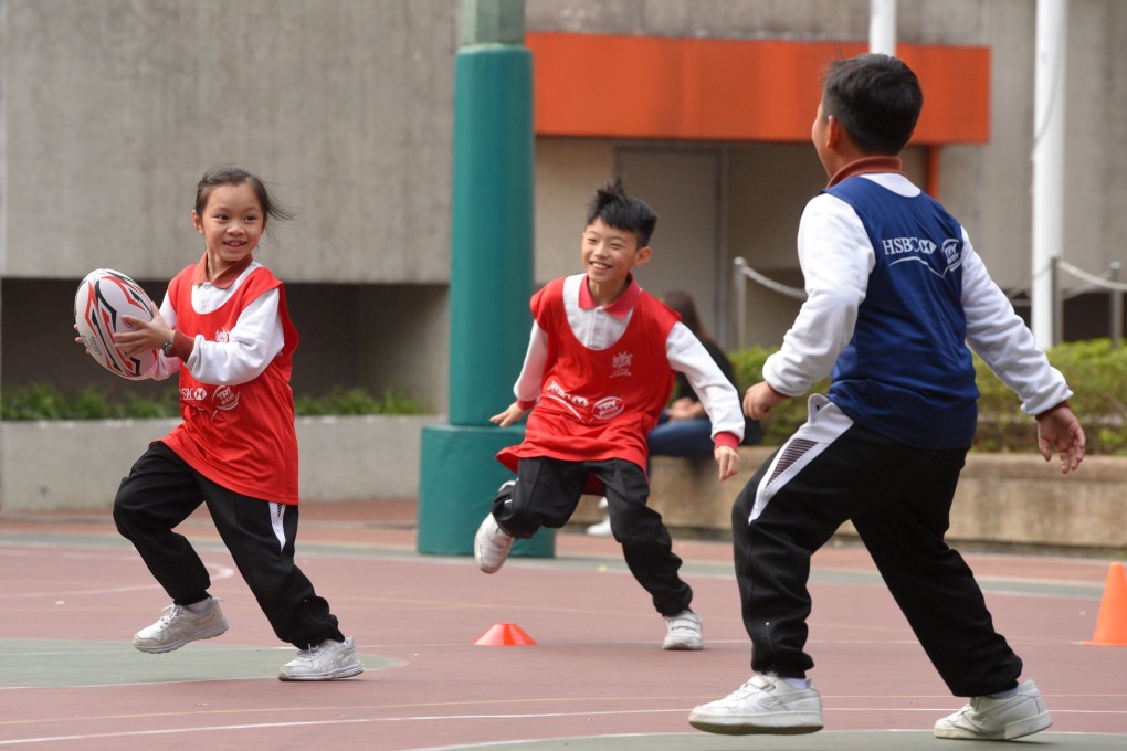Students of a school in Tin Shui Wai play rugby during a special activity in 2017. Taking part in sports and other activities is a way for young people to build rapport and unleash their potential beyond studies. Photo: Handout