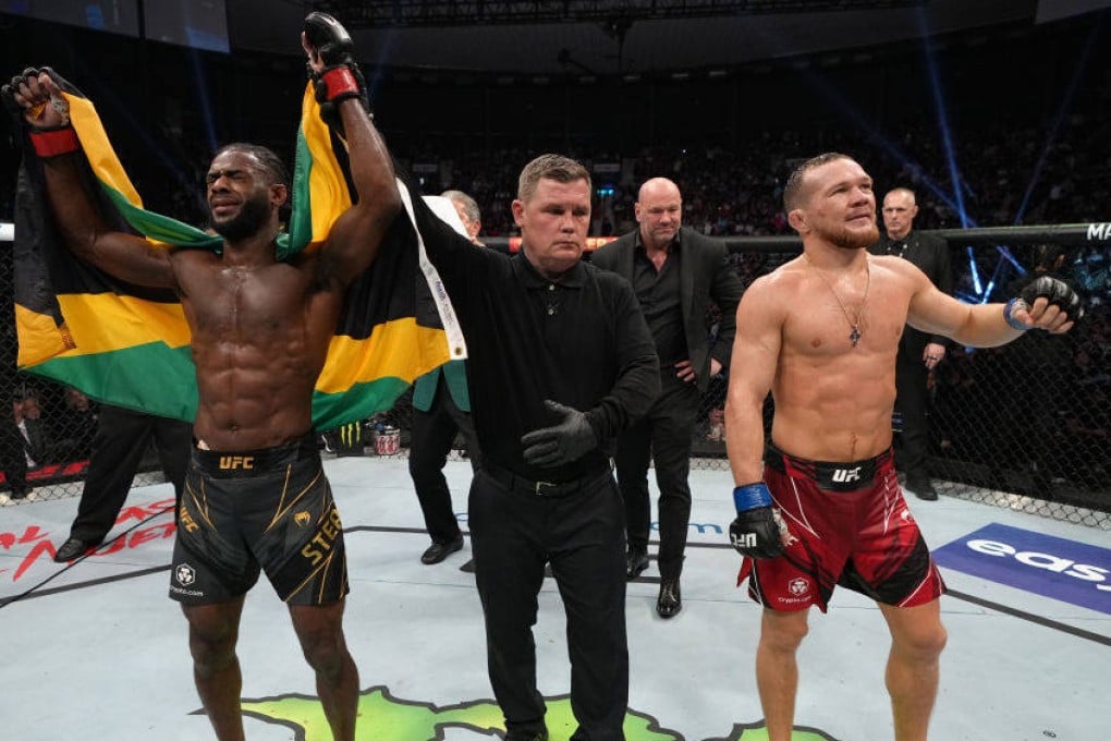 Aljamain Sterling celebrates after defeating Petr Yan of Russia in their UFC bantamweight championship fight at UFC 273. Photo: Jeff Bottari/Zuffa LLC