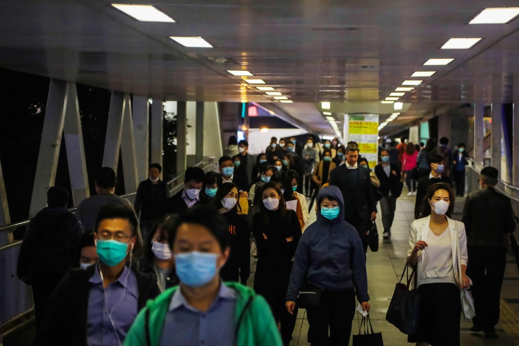 People wear face masks amid concerns about the spread of the Covid-19 coronavirus during the evening rush hour in Hong Kong at the start of the pandemic. Photo: AFP