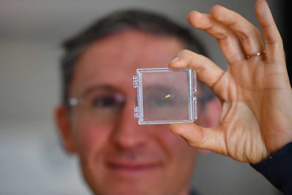 Bionaut Labs CEO and founder Michael Shpigelmacher displays the tiny remote-controlled medical micro-robot his company is developing in Los Angeles in March. Photo: AFP