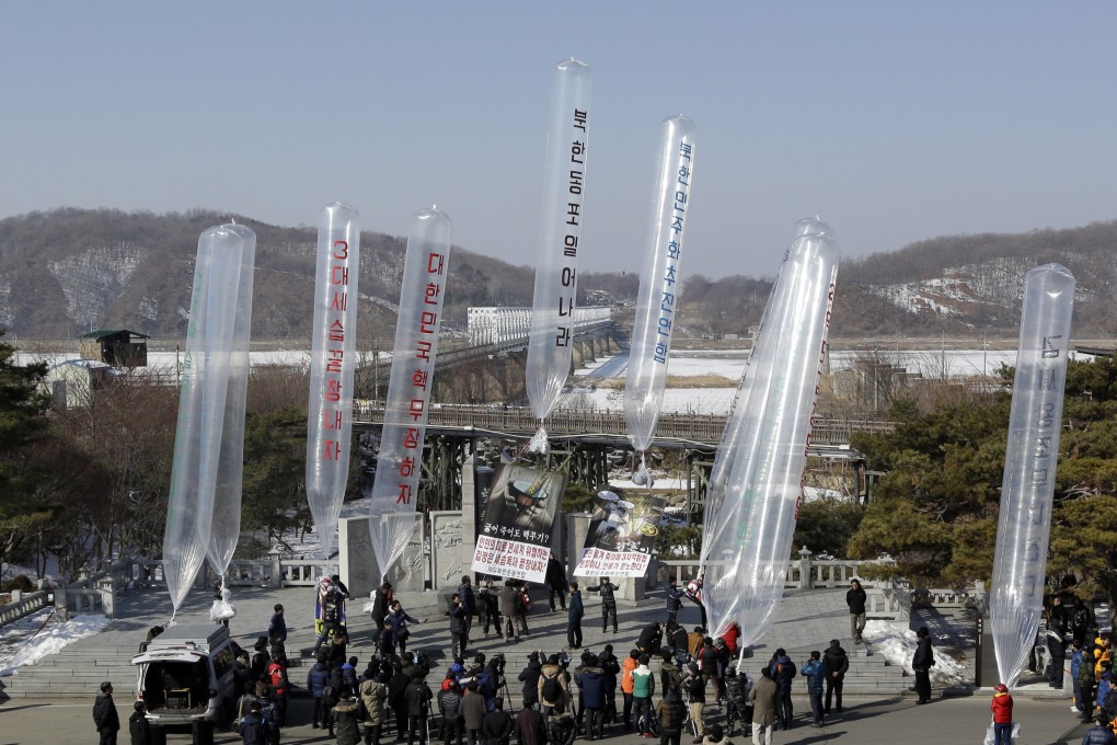 North Korean defectors and South Korean activists launch helium balloons carrying propaganda leaflets in Paju, South Korea. File photo: AP