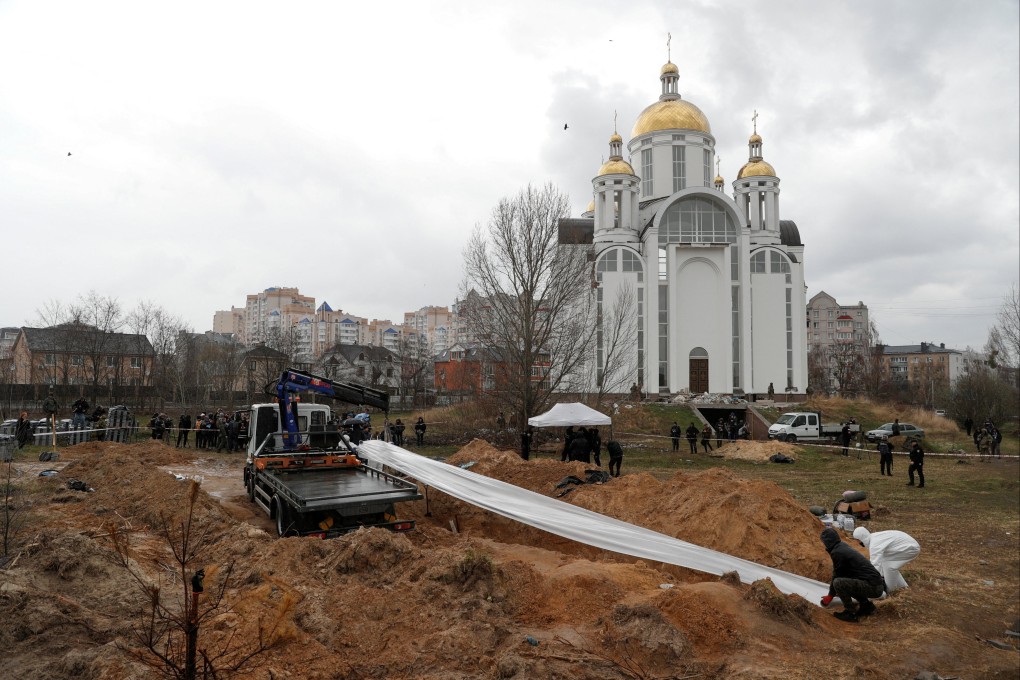Forensic technicians exhume the bodies of civilians who Ukrainian officials say were killed during Russia’s invasion and then buried in a mass grave in the town of Bucha, outside Kyiv. Photo: Reuters