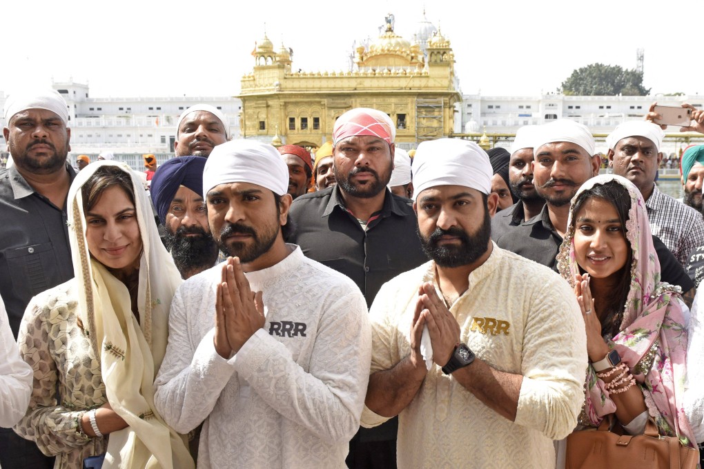 Indian actors NT Rama Rao Jnr, left centre, and Ram Charan, right centre, stars of the Telugu-language period action drama film RRR. Photo: AFP