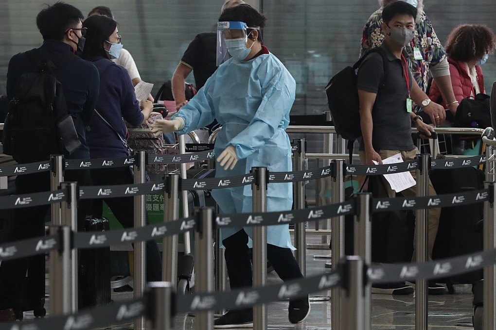 Travellers queue as they arrive at Hong Kong airport on April 2. Hong Kong still has strict testing requirements for arrivals. Photo: Jonathan Wong