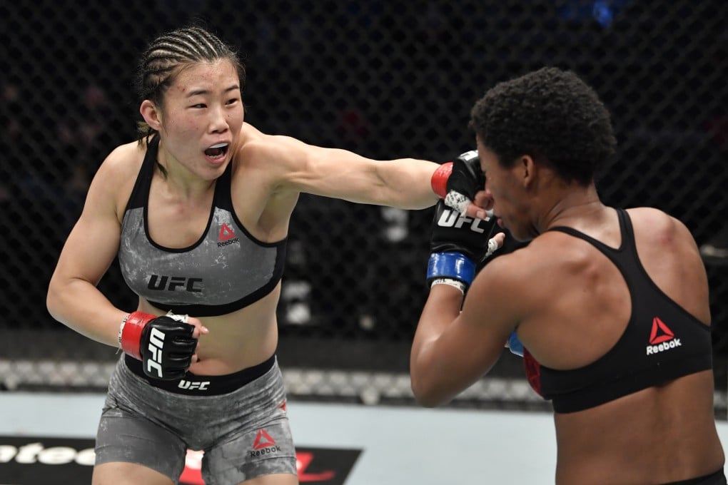 Wu Yanan punches Joselyne Edwards in a bantamweight bout at the Etihad Arena in Abu Dhabi. Photo: Jeff Bottari/Zuffa LLC