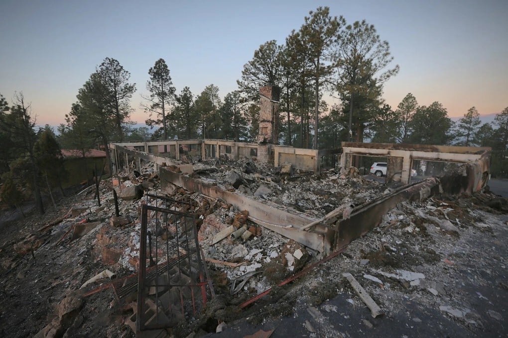 A burned house continues to smoulder following a wildfire in Ruidoso, New Mexico. Photo: via AP