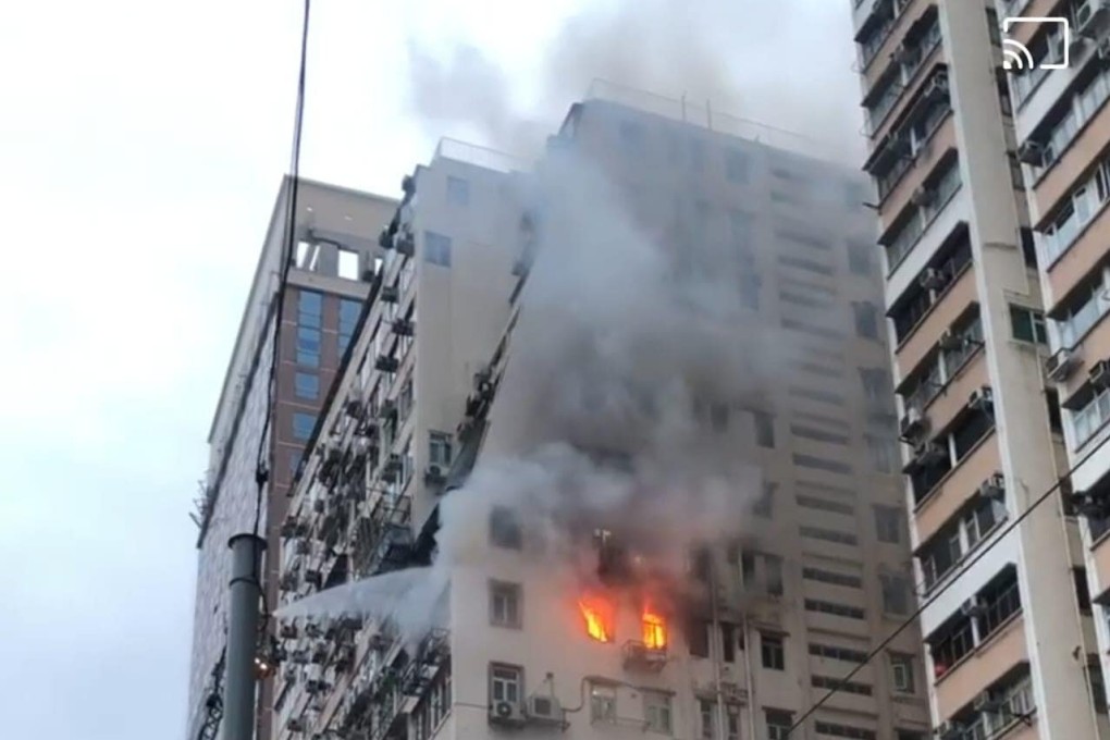 A blaze broke out in a flat in the Yip Cheong Building on Hill Road in Shek Tong Tsui on Sunday. Photo: SCMP
