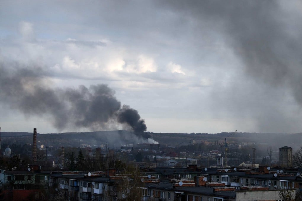 Dark smoke rises following an air strike in the western Ukrainian city of Lviv on Monday. Photo: AFP