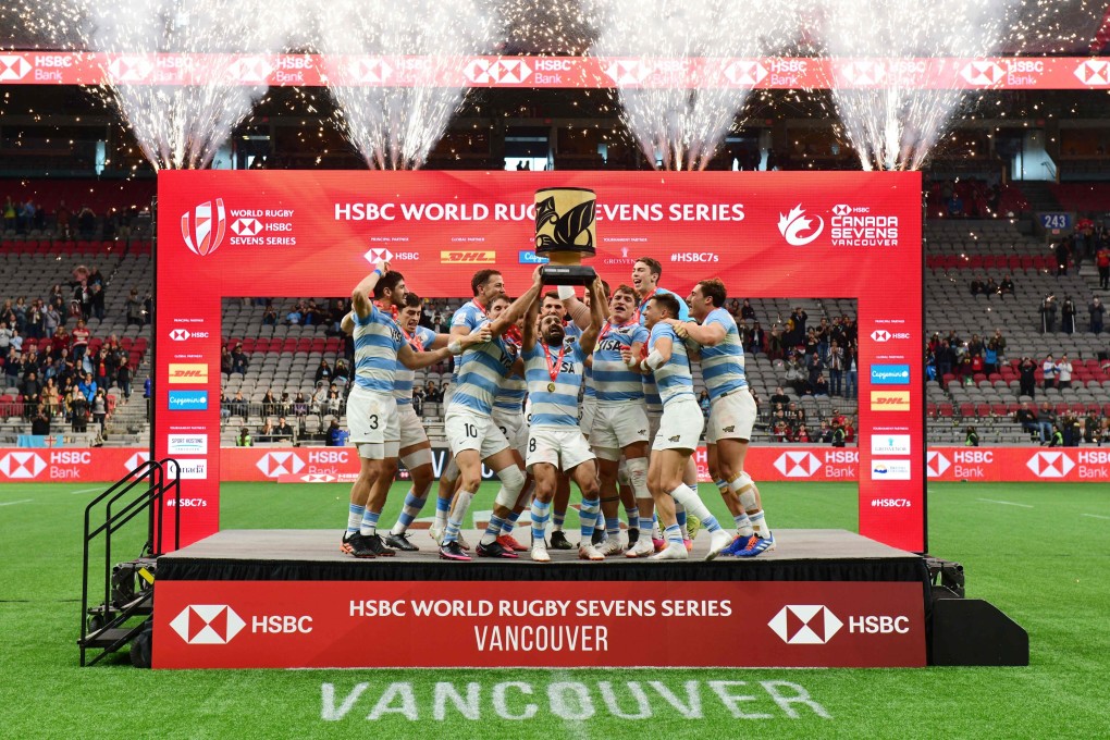 Argentina’s players celebrate with the trophy after winning the Vancouver leg of the HSBC World Rugby Sevens Series. Photo: AFP