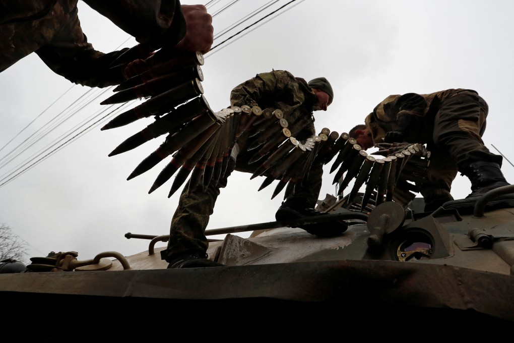 Service members of pro-Russian troops load ammunition into a tank during fighting in Mariupol, Ukraine on April 12. The world’s militaries are responsible for about 6 per cent of global greenhouse gas emissions. Photo: Reuters