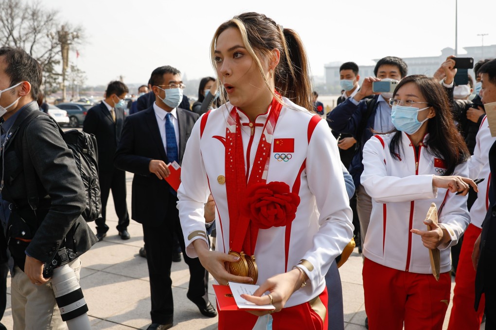 Chinese Olympian Eileen Gu reacts after being mobbed by fans and journalists during her arrival at the awards ceremony for the Beijing 2022 Winter Olympic and Paralympic Games at the Great Hall of the People on April 8, 2022. Photo: EPA-EFE/Mark R. Cristino