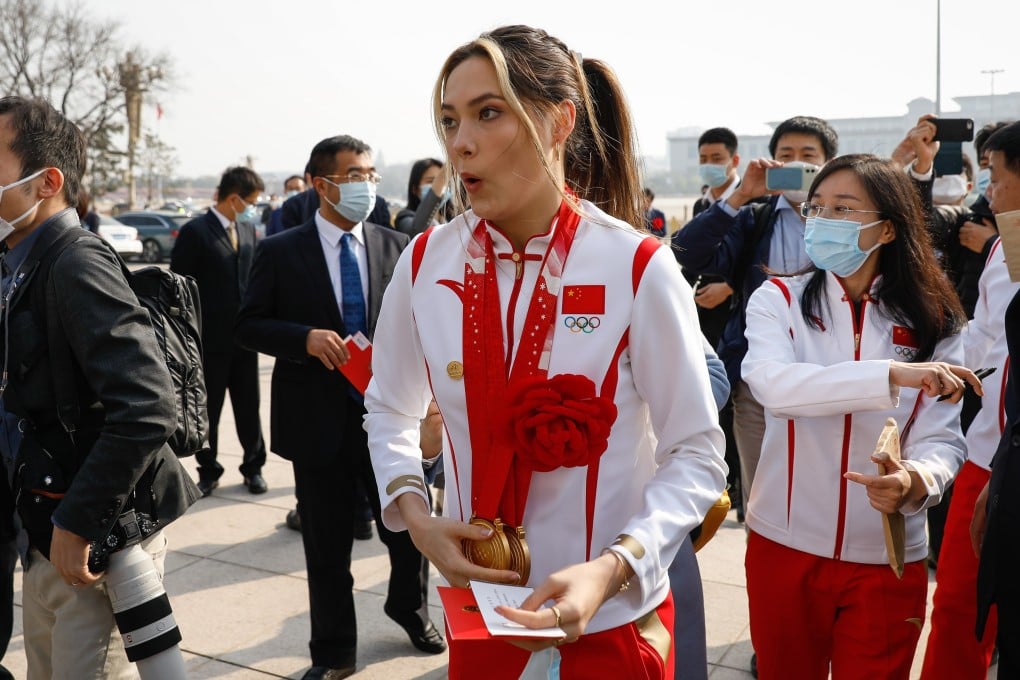 Chinese Olympian Eileen Gu reacts after being mobbed by fans and journalists during her arrival at the awards ceremony for the Beijing 2022 Winter Olympic and Paralympic Games at the Great Hall of the People on April 8, 2022. Photo: EPA-EFE/Mark R. Cristino