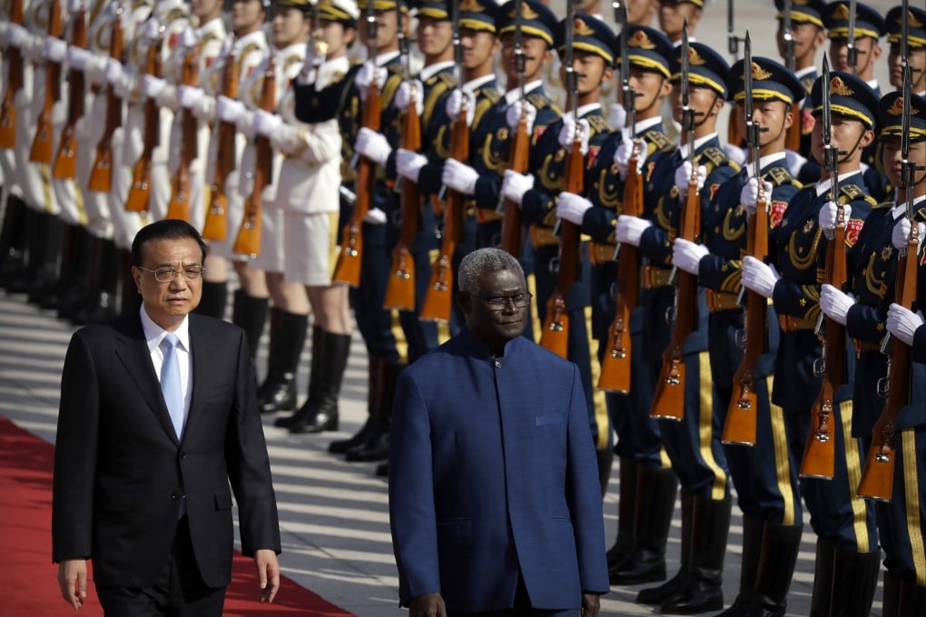 Chinese Premier Li Keqiang, left, and Solomon Islands Prime Minister Manasseh Sogavare are pictured in 2019. The US announced on Monday it was sending two top officials to the Solomons over concerns China could establish a military presence in the island nation. Photo: AP Photo