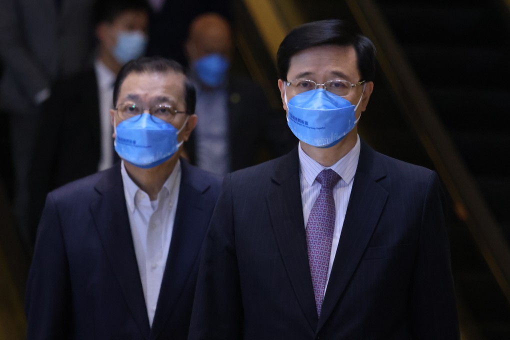 Chief Executive candidate John Lee (right) and his campaign office director Tam Yiu-chung meet the media. Photo: Nora Tam