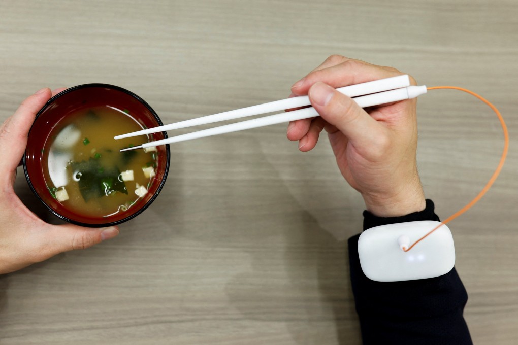 Chopsticks that can enhance food taste using an electrical stimulation waveform invented in Tokyo. Photo: Reuters