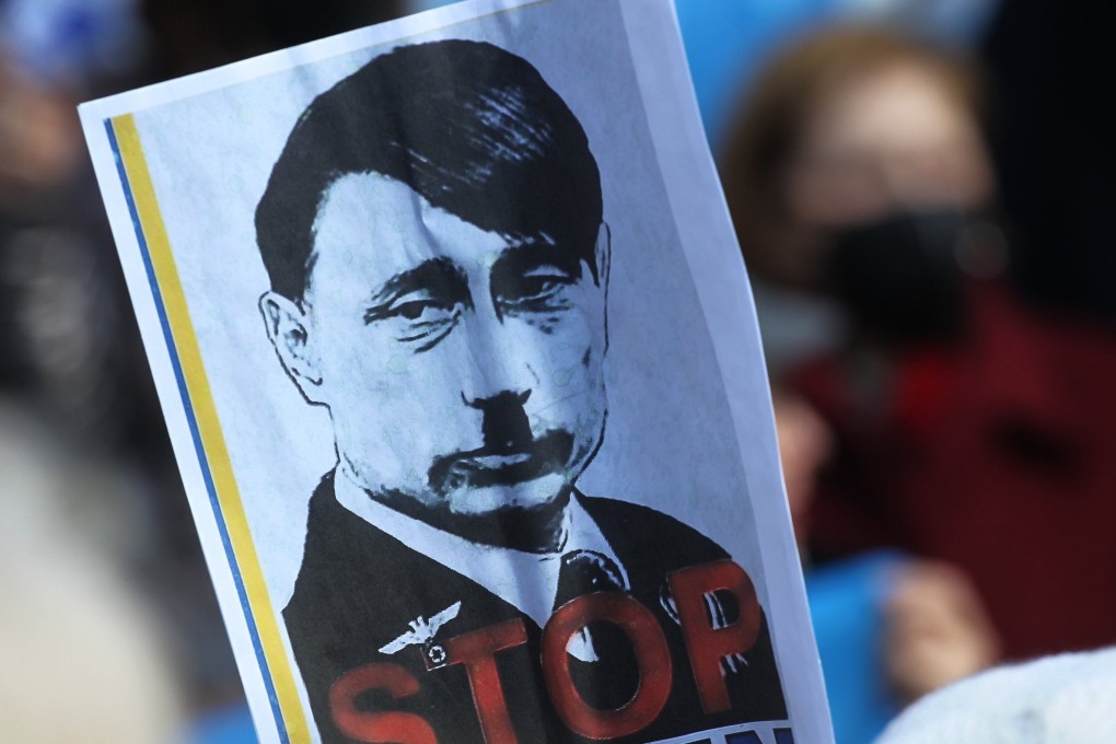 A caricature of Russian President Vladimir Putin as a Hitler-like figure is seen at a rally in Greece against the invasion of Ukraine. Photo: dpa