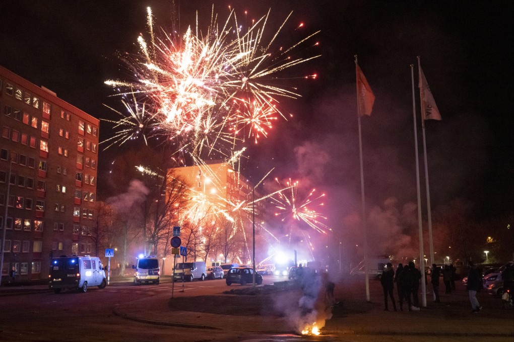 Police vans gather at the scene where unrest broke out in Rosengard in Malmo, Sweden, early on April 17. Photo: TT via AP