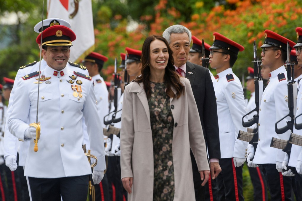 New Zealand’s Prime Minister Jacinda Ardern inspects an honour guard with Singapore’s Prime Minister Lee Hsien Loong during a welcome ceremony at the Istana in Singapore April 19, 2022. Then Chih-Wey/Pool via REUTERS