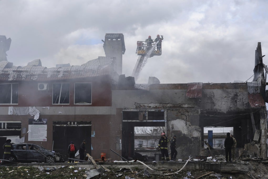 Firefighters work to extinguish a fire after an airstrike in Lviv, Ukraine, on Monday. Russian troops have intensified attacks in preparation for an all-out assault on the east. Photo: AP
