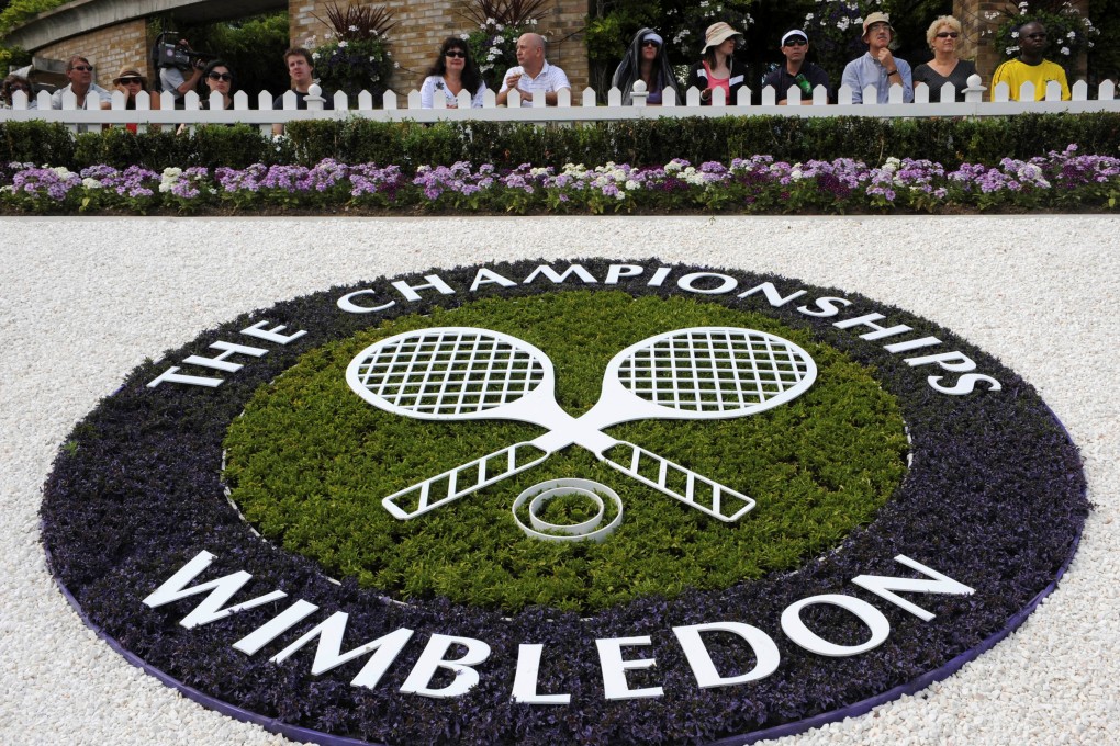 The Wimbledon logo is seen inside the grounds at the Wimbledon tennis championships in London. A report in Sportico claims the tournament will ban Russian tennis players from competing due to Moscow’s invasion of Ukraine. Photo: Reuters