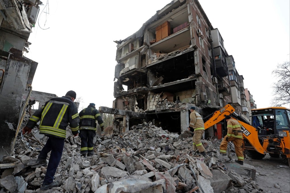 Rescuers work at a damaged residential building in Mariupol, Ukraine. Photo: Reuters