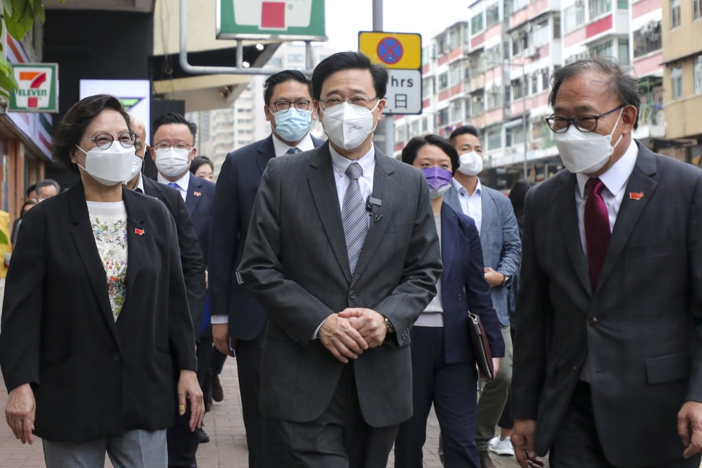 Chief executive hopeful John Lee Ka-chiu (centre) arrives at the New Territories Association of Societies in Tai Po on April 16. Lee has pledged to improve civil service procedures once he takes office. Photo: Xiaomei Chen