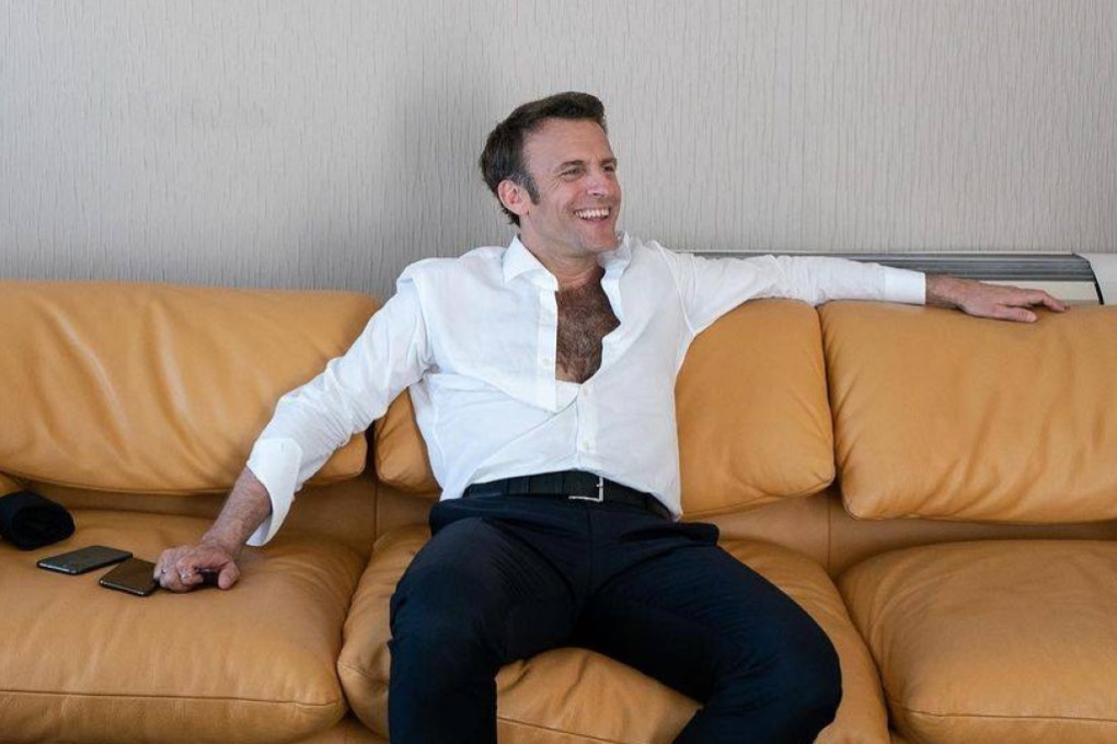 French President Emmanuel Macron reclines on a sofa, the top four buttons of his white shirt undone to reveal a full pelt of dark chest hair - an image that saw social media users compare him to Sean Connery and Tarzan. Photo: Soazig de la Moissonnière