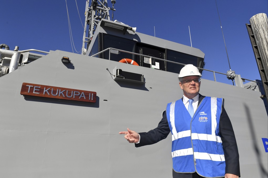 Australian Prime Minister Scott Morrison poses next to a patrol boat in Perth on April 18. Photo: AAP Image via AP
