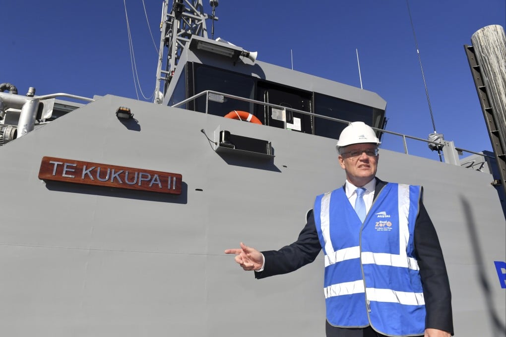 Australian Prime Minister Scott Morrison poses next to a patrol boat in Perth on April 18. Photo: AAP Image via AP