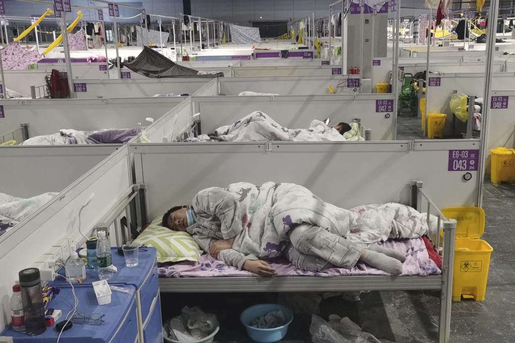 Residents at a temporary hospital converted from the National Exhibition and Convention Center to quarantine COVID-positive patients in Shanghai on April 18, 2022. Photo: AP