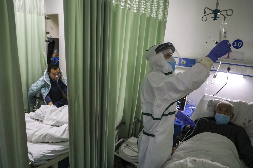 A nurse checks on a patient in a Covid-19 isolation ward in the Chinese city of Wuhan, in Hubei province, during the early days of the pandemic in 2020. Photo: AP