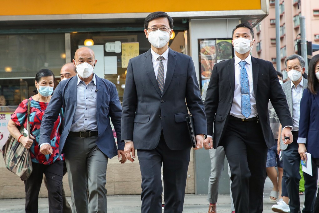 Chief executive candidate John Lee (centre) visits the Hong Kong Federation of Trade Unions in To Kwa Wan on April 11. In his election campaign, he agreed that Article 23 would be one of his priorities. Photo: Edmond So