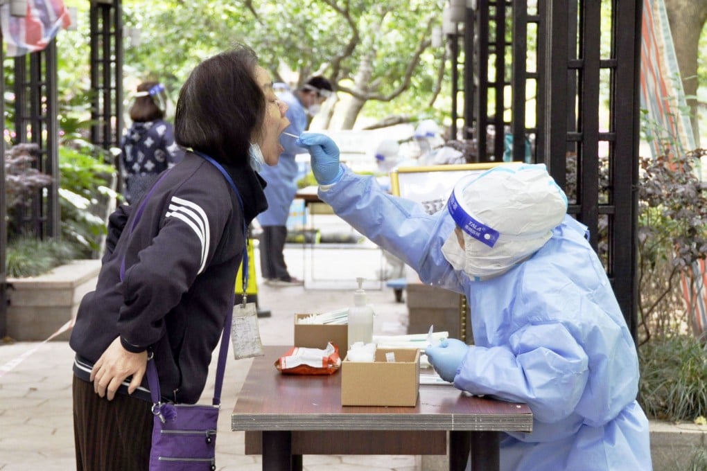 A woman gets tested for Covid-19 at a condominium in Shanghai on April 18. Photo: Kyodo