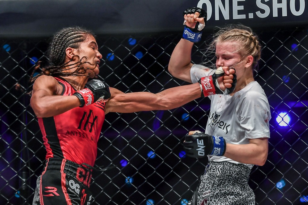 Anissa Meksen (left) cracks Marie Ruumet with a straight left at ONE 156 in Singapore. Photos: ONE Championship