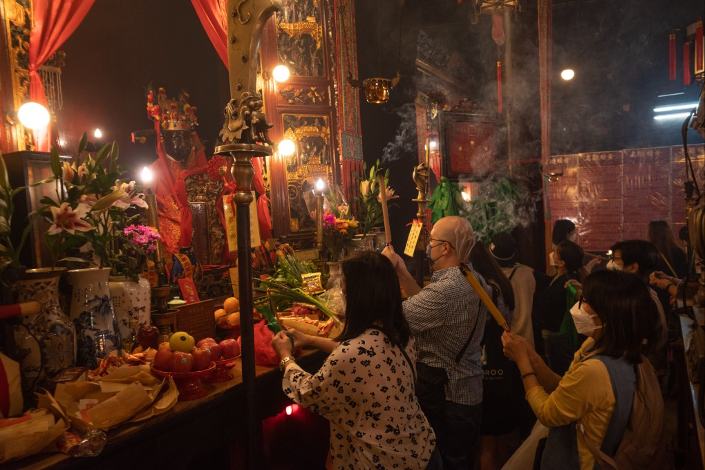 Worshipers at Man Mo Temple after it reopened on April 21. Hong Kong is beginning a slow path back to some sort of normality as the city’s worst Covid outbreak wanes. Photo: Bloomberg