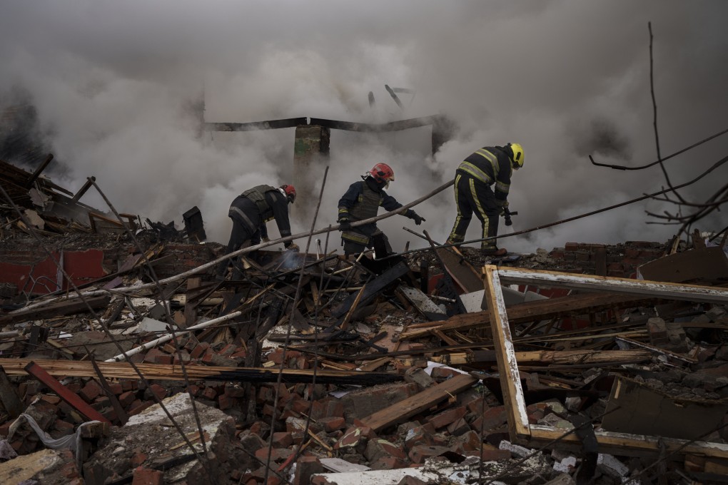 Firefighters work to extinguish a fire at a destroyed culinary school in Kharkiv, Ukraine, earlier this month following a Russian attack. Photo: AP