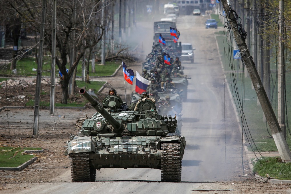 An armoured convoy of pro-Russian troops moves along a road in Mariupol, Ukraine on Thursday. Photo: Reuters