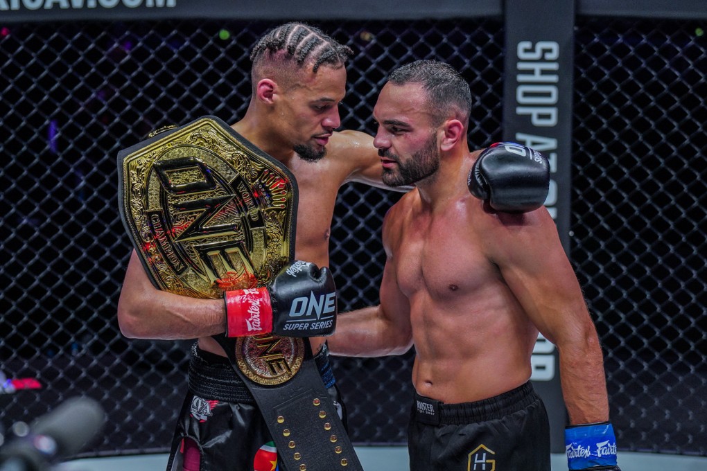 Regian Eersel (left) and Arian Sadikovic embrace after their lightweight kick-boxing title fight at ONE 156 in Singapore. Photos: ONE Championship.