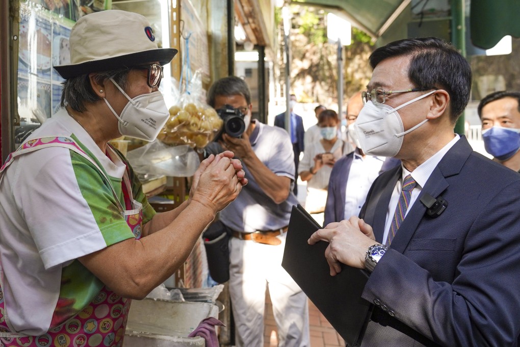 Hong Kong chief executive candidate John Lee meets residents in North Point earlier this month. Photo: Sam Tsang