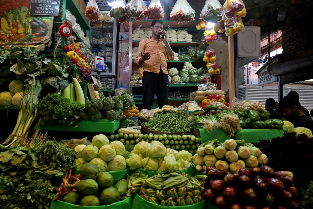 A vegetable vendor at a retail market in Kolkata, India. Photo: Reuters