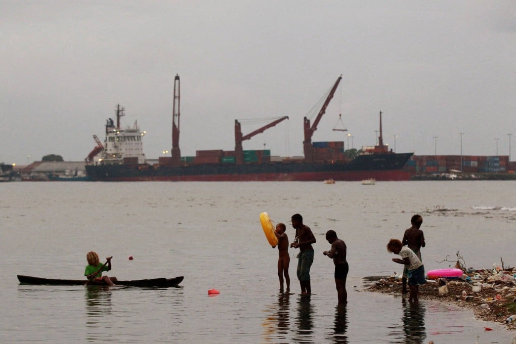 Children fish at a beach in central Honiara, the capital of the Solomon Islands. Photo: Reuters/File