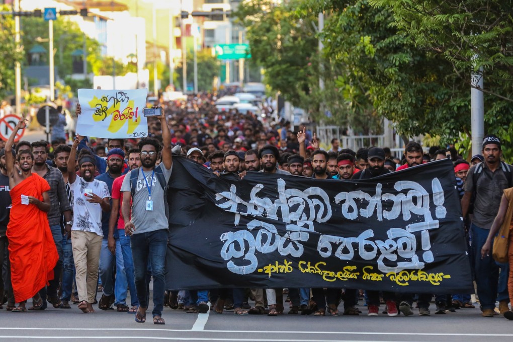 University students shout slogans during a protest march in Colombo. Photo: EPA-EFE