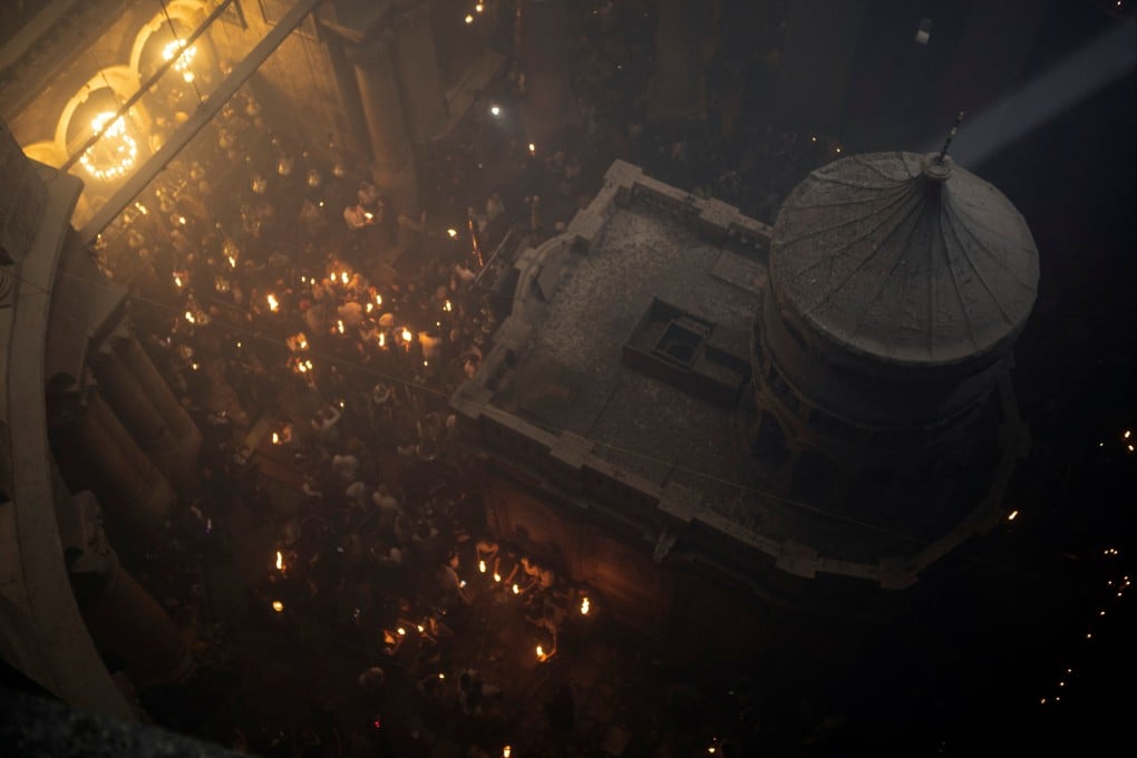 Orthodox Christian worshippers attend the Holy Fire ceremony at the Church of the Holy Sepulchre in Jerusalem’s Old City in Israel on April 23. Photo: Reuters