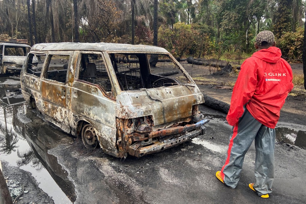 A man looks at the scene of explosion in Imo state, Nigeria. Photo: Reuters