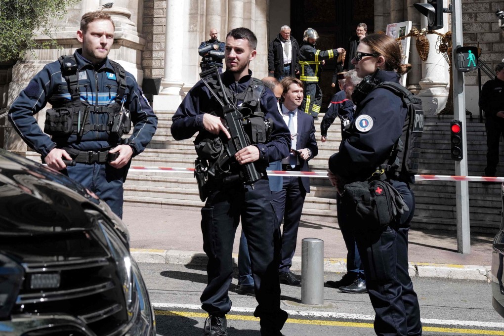 Police officers stand guard outside Saint-Pierre d’Arene church following an attack on a priest in the French riviera city of Nice on April 24. Photo: AFP