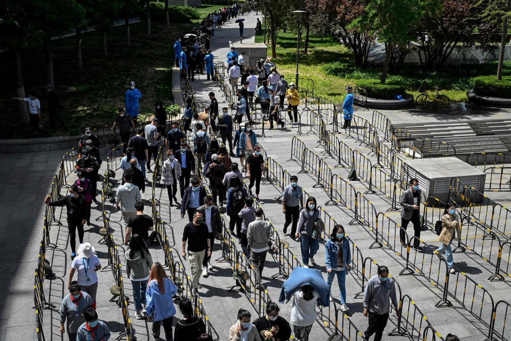People line up to be tested for Covid-19 in Zhongguancun in Beijing on Tuesday. Photo: AFP