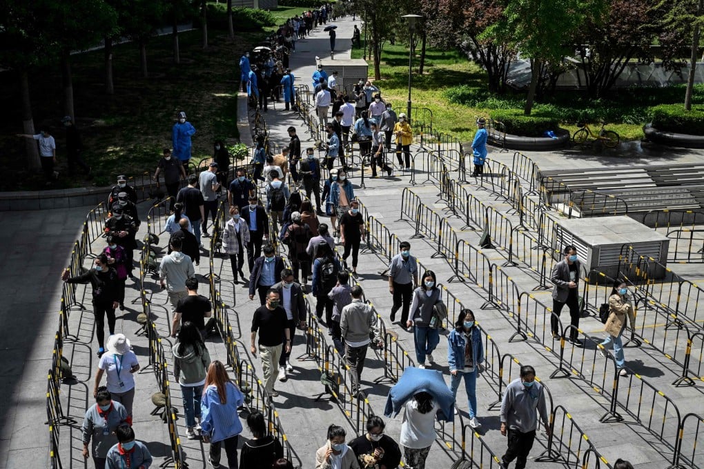 People line up to be tested for Covid-19 in Zhongguancun in Beijing on Tuesday. Photo: AFP