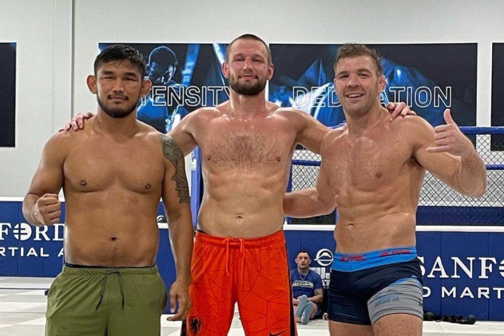 Aung La N Sang (left), Reinier de Ridder (centre) and Dricus Du Plessis pose for a photo after a training session at Sanford MMA in Florida. Photo: Reinier de Ridder/Instagram