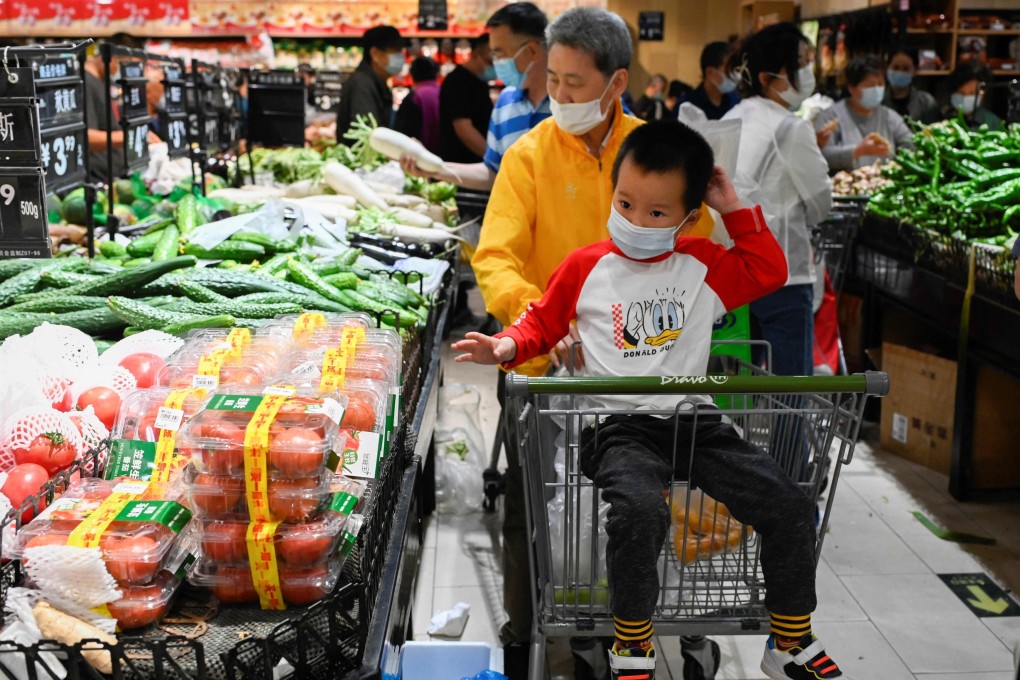 People shop at a supermarket in Beijing on April 25. China’s economy is growing well below the pace recorded from 2010 to 2019, removing a potential cushion that supported global growth during previous crises. Photo: AFP